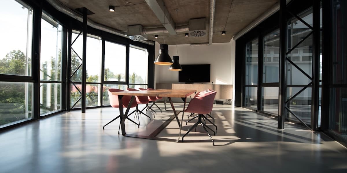 Modern meeting room with natural light and wooden table