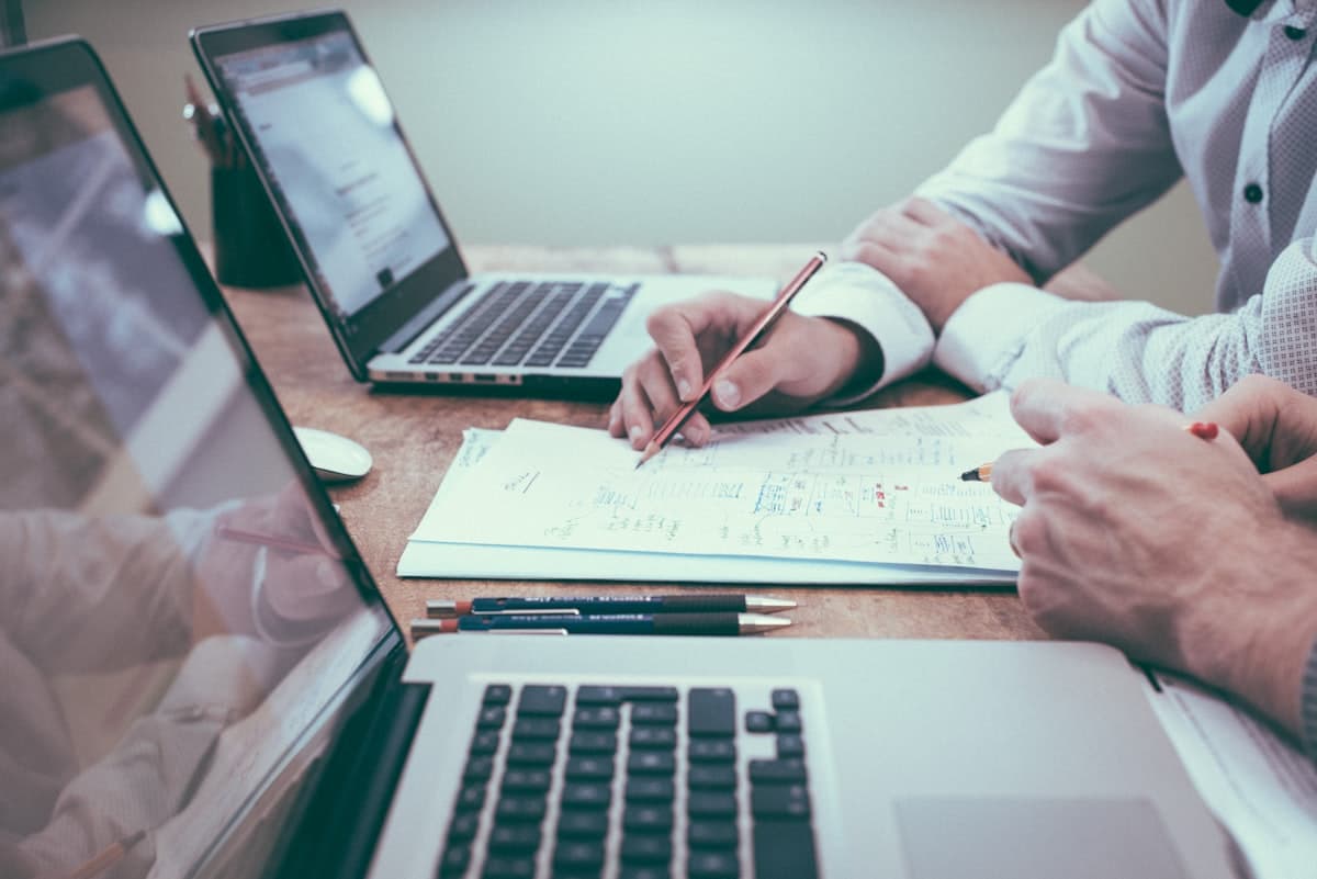 Two professionals openly reviewing financial documents together